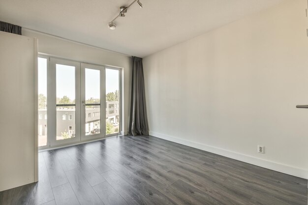 Interior of empty white kitchen with windows and wooden parquet floor