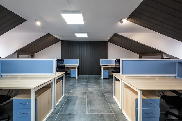 Interior in empty work mansard room in modern office or coworking