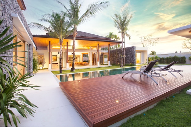 Interior and exterior design of pool villa which features living area