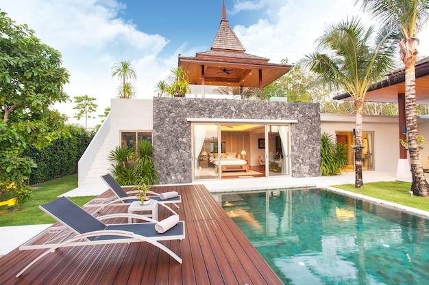 Interior and exterior design of pool villa which features living area