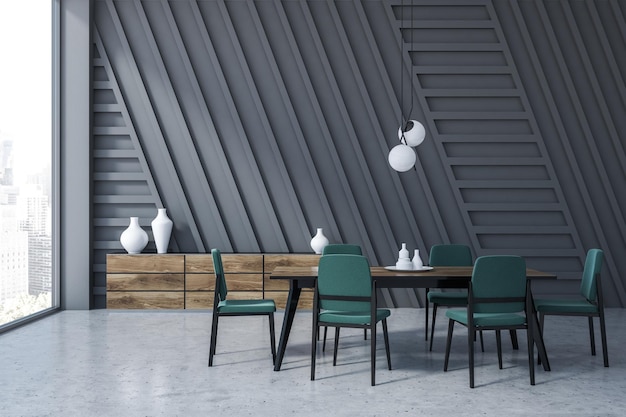 Interior of gray dining room with concrete floor, black and wooden table with green chairs and wooden closet. 3d rendering