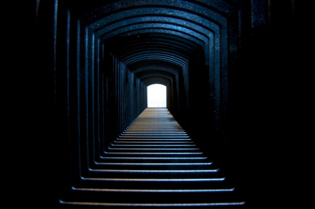 Interior of illuminated blue tunnel