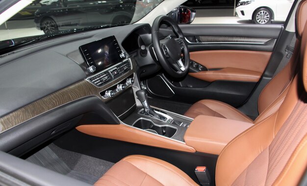 The interior or inside of ecocar car that\'s luxury brown color\
style as console display leather