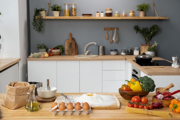 Interior of kitchen with table and fresh vegetables