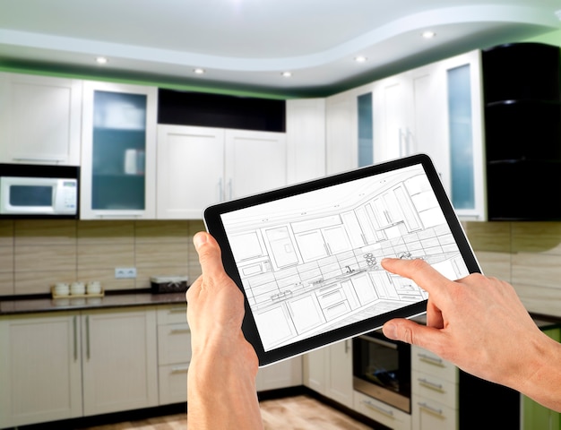 Interior layout plan on tablet computer. business. kitchen