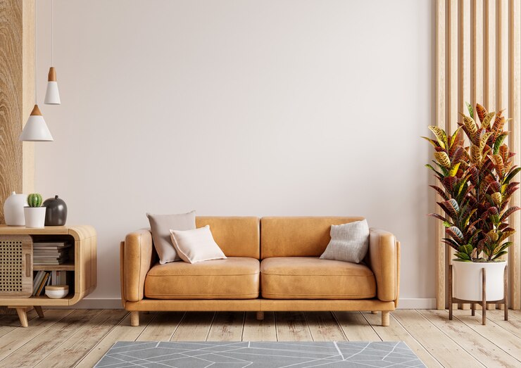 Photo interior living room wall mockup with leather sofa and decor on white background.3d rendering