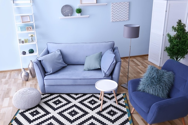 interior of living room with comfortable armchair and sofa