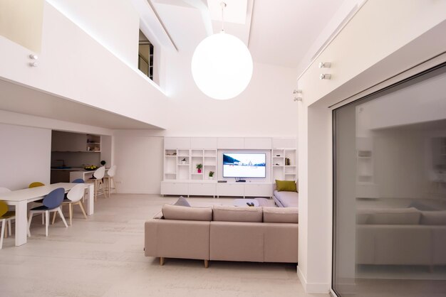 interior of a luxury stylish modern open space design two level apartment with white walls