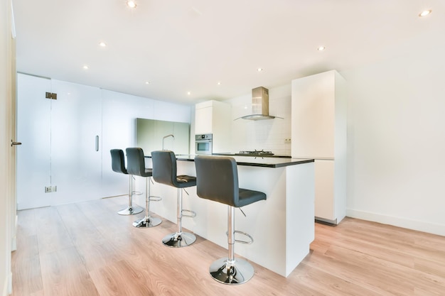 The interior of a magnificent kitchen with a black countertop