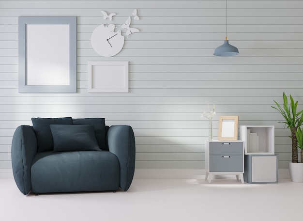 Interior mockup In a white room a dark blue sofa is placed next to a photo frame on the wall