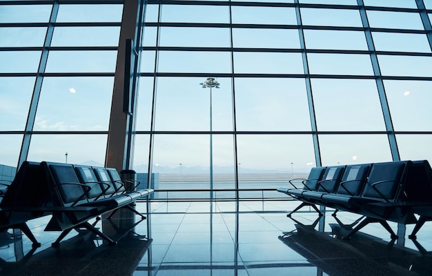 Interior of modern airport at daytime with no people inside it