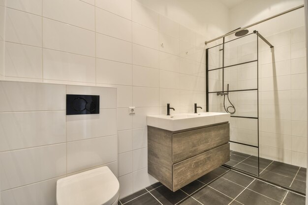 Interior of a modern bathroom with shower and sink