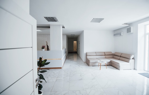 Interior of modern clinic waiting room at daytime. No people inside.