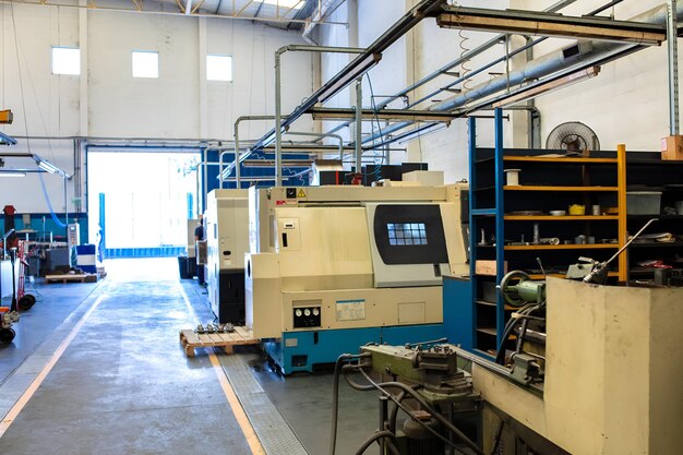 Interior of modern factory shopfloor with automatic machines