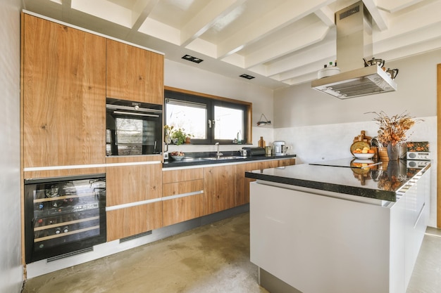 Interior of modern home kitchen with furniture and appliances