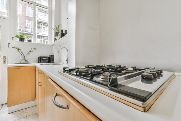 Interior of modern home kitchen with furniture and appliances