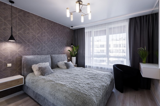 Interior of a modern hotel room with a large double bed