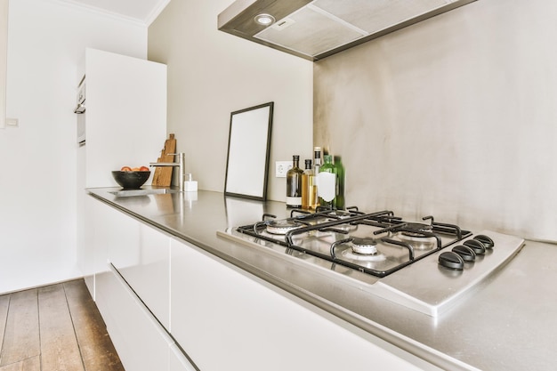 Interior of modern kitchen with white furniture