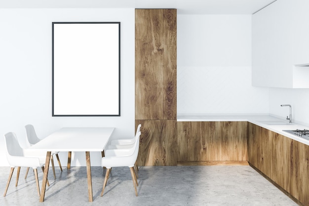 白い壁、石の床、白い食器棚、木製のカウンタートップ、白いテーブルと椅子を備えたモダンなキッチンのインテリア。壁に貼られた縦型ポスター。 3D レンダリングのモックアップ