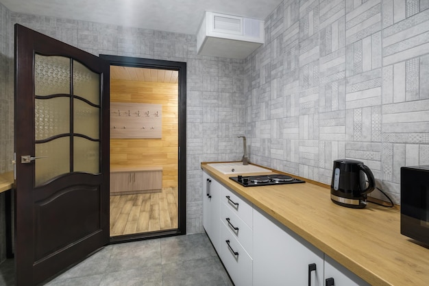 Interior of the modern luxure kitchen in studio apartments with cupboard