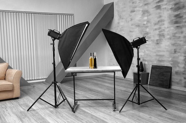 Interior of modern photo studio with professional lighting equipment