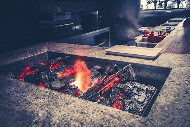 Interior of modern restaurant with fireplace close-up