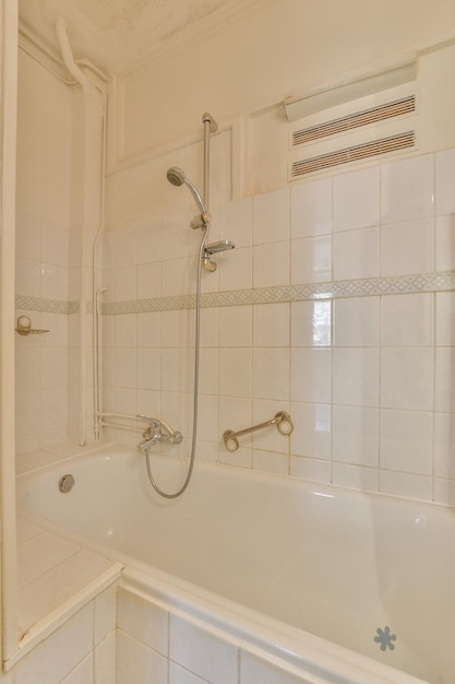 Interior of modern restroom with bathtub