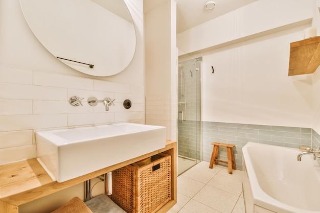 Interior of modern restroom with bathtub