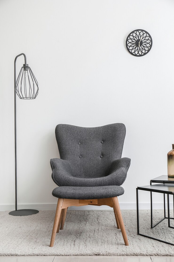 Photo interior of modern room with table, armchair and ottoman