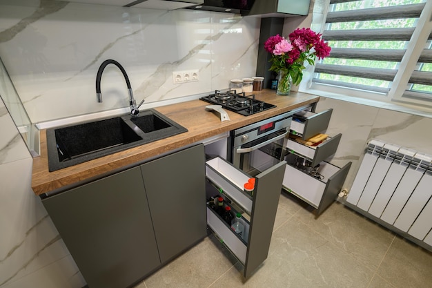 Interior of modern trendy grey kitchen