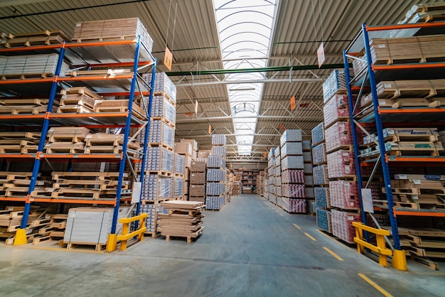 Interior of modern warehouse. Rows of shelves with boxes.