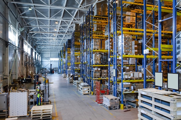 Interior of a modern warehouse storage of retail shop with
pallet truck near shelves