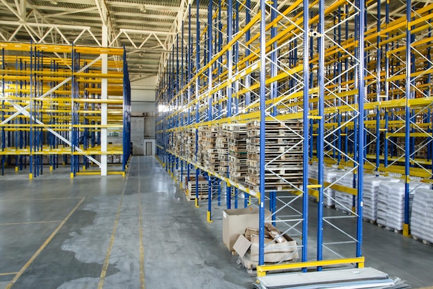 Interior of a modern warehouse storage of retail shop with
pallet truck near shelves