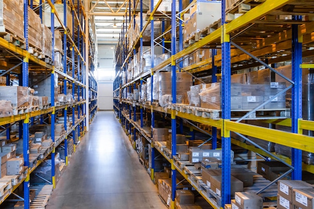 Interior of a modern warehouse storage with rows and goods boxes on high shelves