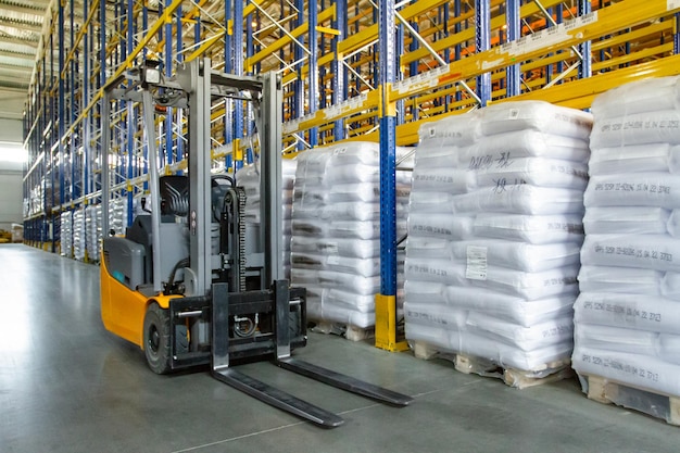 Interior of a modern warehouse with forklifts Pallet stacker truck equipment at warehouse Forklift loader