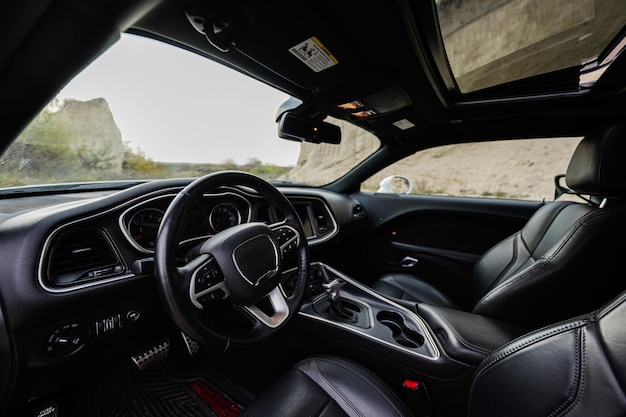 Interior of the muscle car Black leather chairs