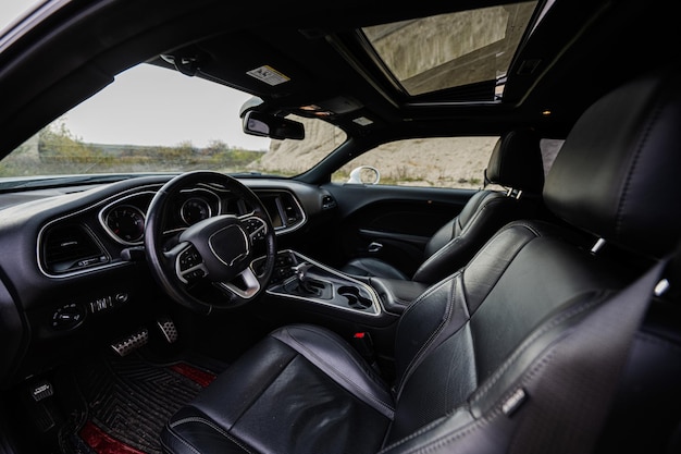 Interior of the muscle car Black leather chairs