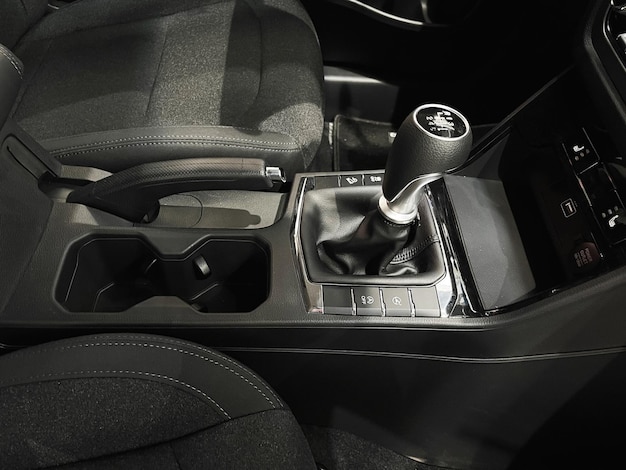 The interior of a new car with a black interior. Manual transmission in leather trim