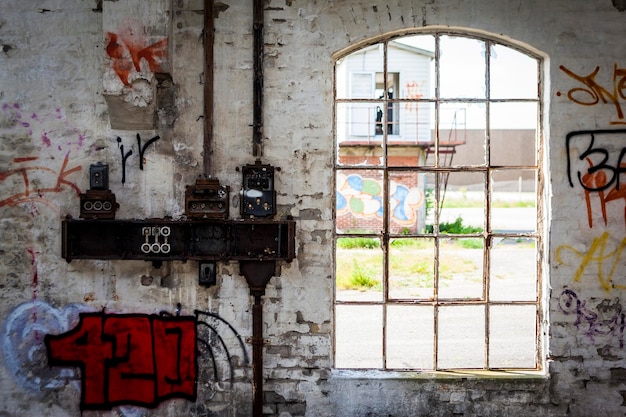 Interior of old rustic building with drawings on the wall