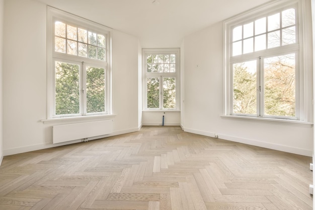 The interior of an open empty room in a studio apartment with a white decoration