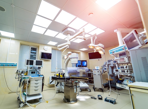 Interior of operating room in modern clinic lamps and ultra modern devices technology in modern clinic