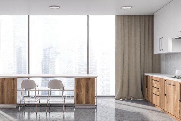 Interior of panoramic kitchen with white walls, concrete floor, wooden countertops, white cupboards and white bar with stools. 3d rendering