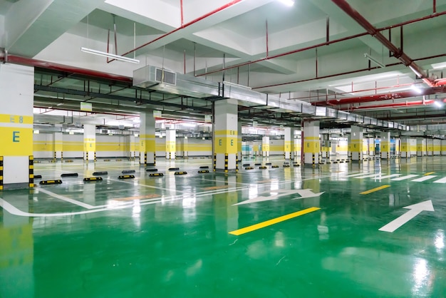 interior of parking garage with car and vacant parking lot in parking building