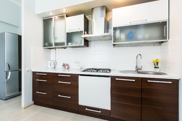 interior photo of modern kitchen in dark colors of wood