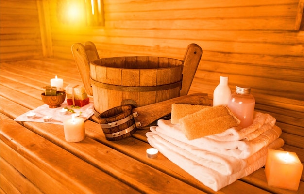 Interior of sauna and sauna accessories on background