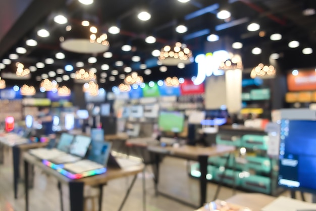 Photo interior shop store with computer laptop and accessory on blurred background