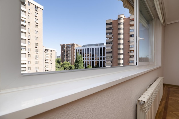 Interior sill of a sliding white aluminum window