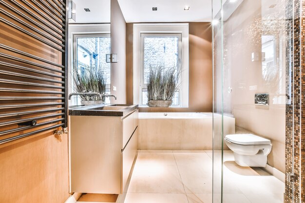 Photo interior of small clean bathroom in warm colors