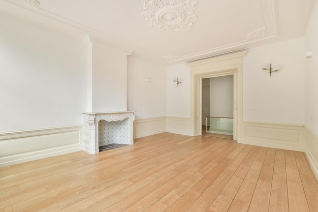 Interior of spacious light room with fireplace