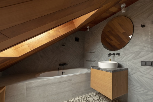 Interior of stylish attic bathroom